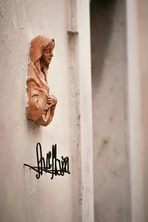 Bas-relief of a holy woman on the building