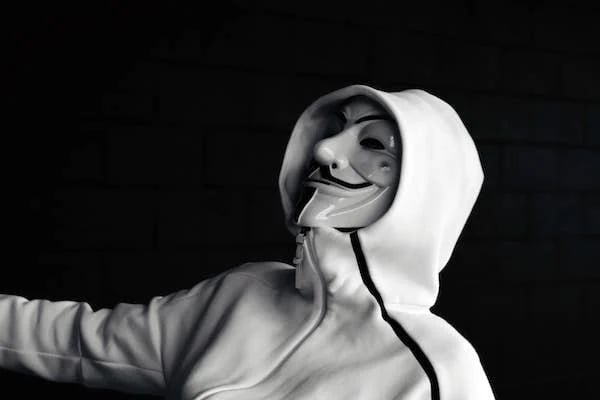 Boy in white hoodie and mask