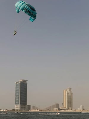 Person in the parachute above Dubai
