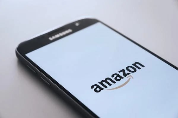 Mobile screen with Amazon logo on it