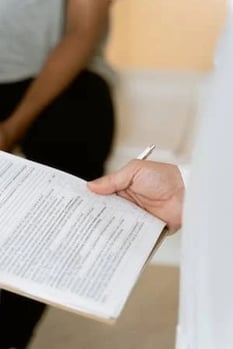 Document in the hand of a man