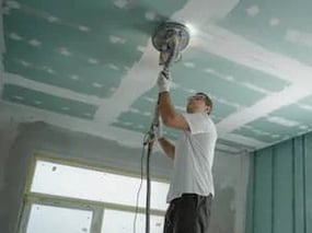 Man doing ceiling screed