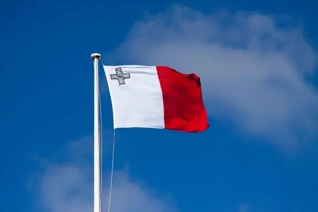 Flag of Malta against blue sky