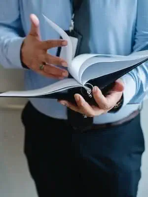 A man flips through a notebook (1)